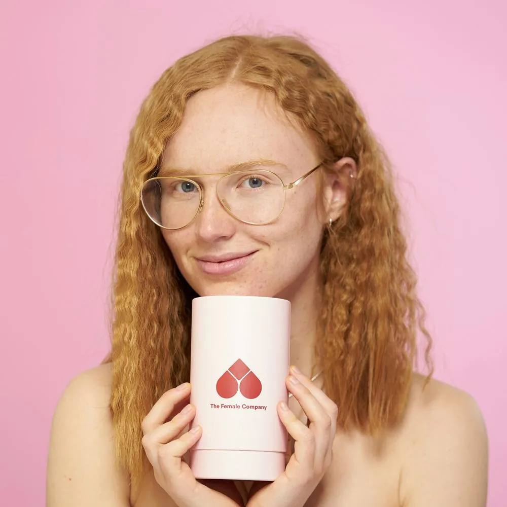 Creator holding a skincare product
