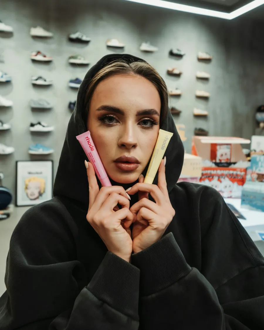 Beauty creator holding lip products