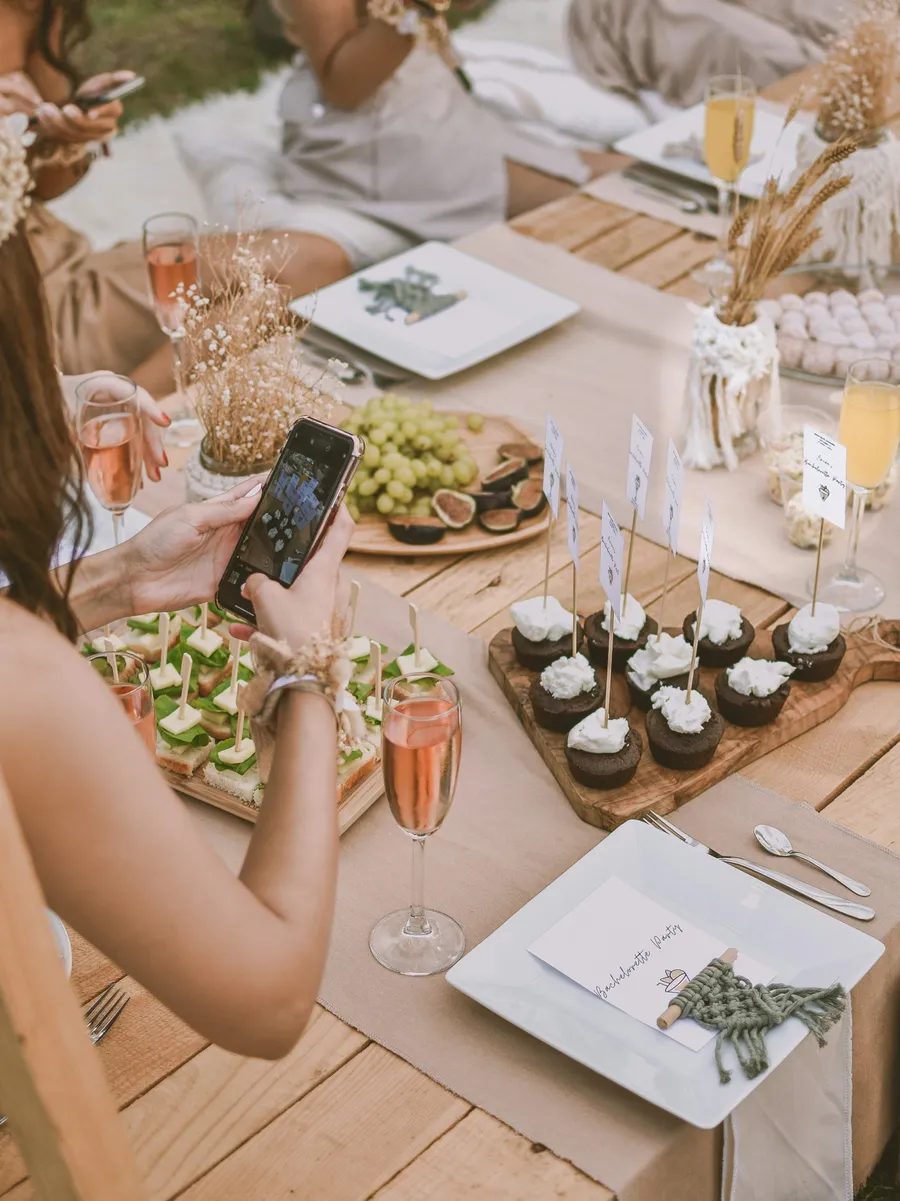 Guest filming an event table for social media